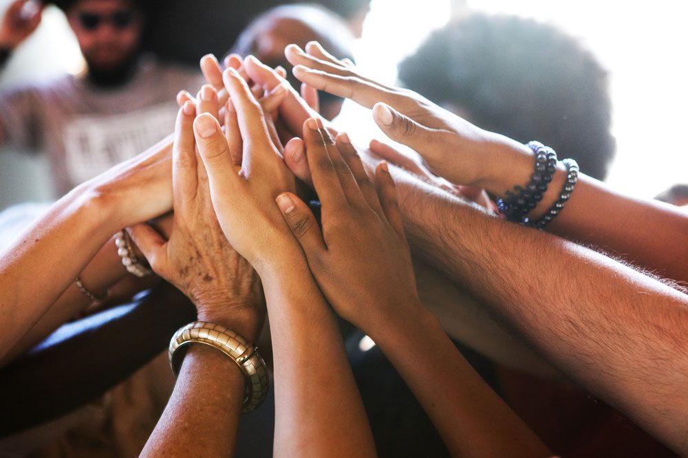 group of diverse hands together