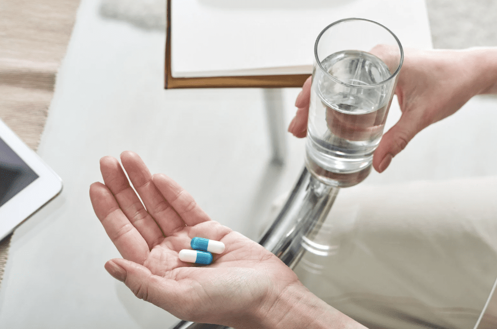 A person taking medication.